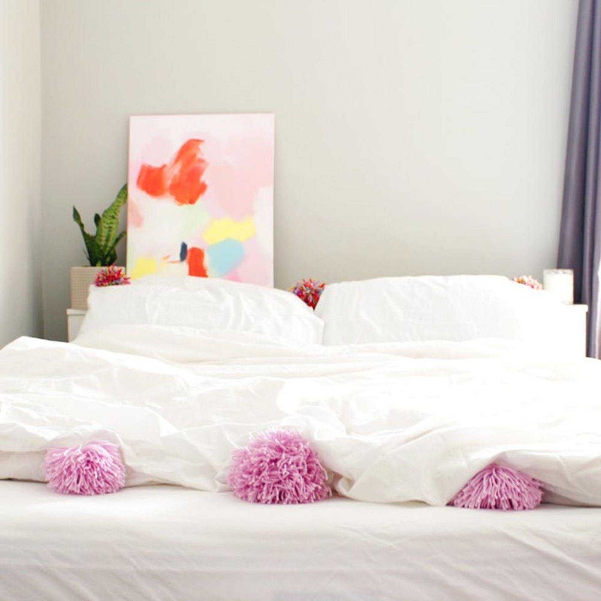 Upgrade Your Bedding With DIY Pom Pom Pillows and Duvet - Brit + Co