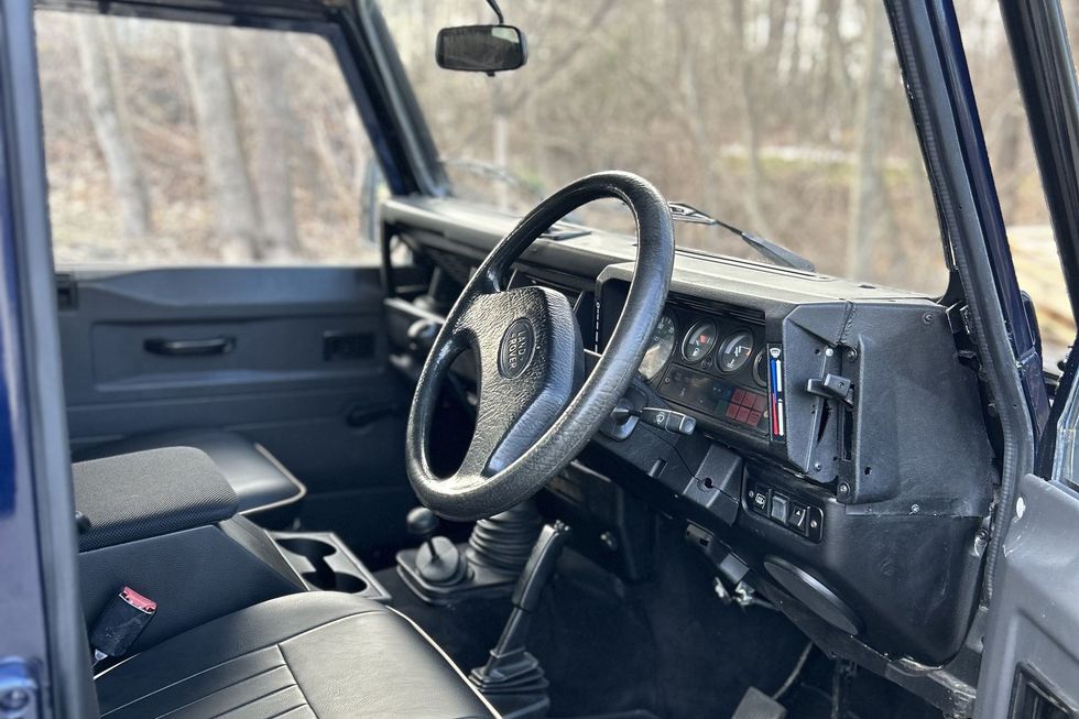 1996 Land Rover Defender 110 interior showing right-hand-drive steering wheel