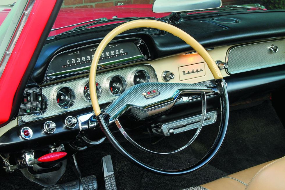 Color closeup of the dash, steering wheel and interior in a 1957 Dodge Custom Royal D-500.