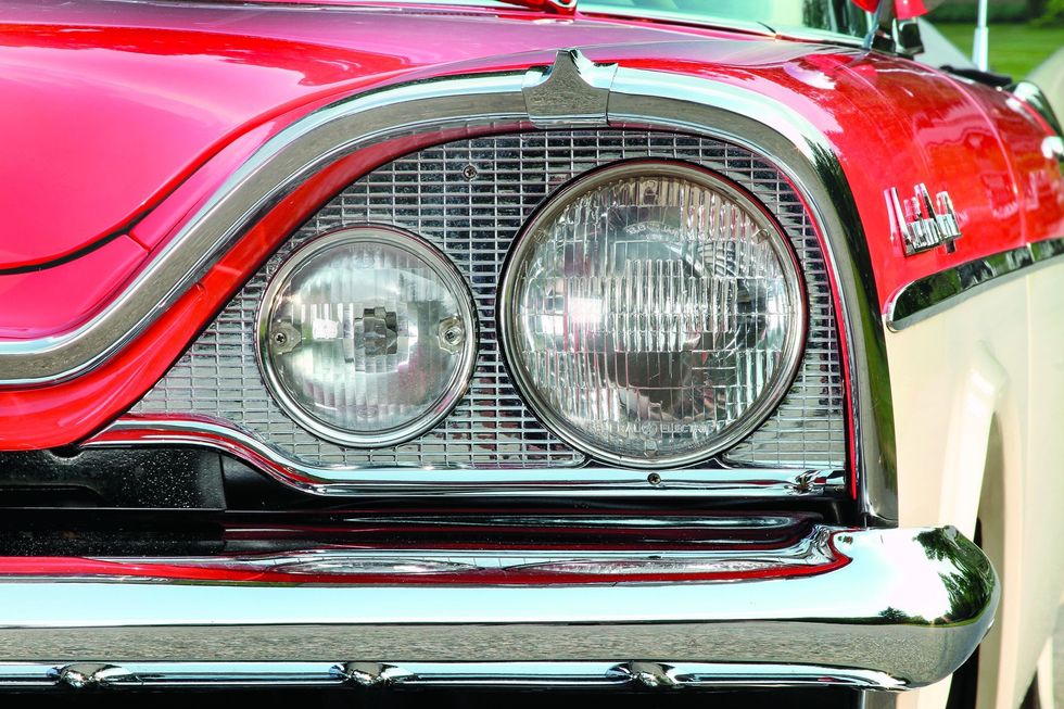Color closeup of the head lamps on a 1957 Dodge Custom Royal D-500.