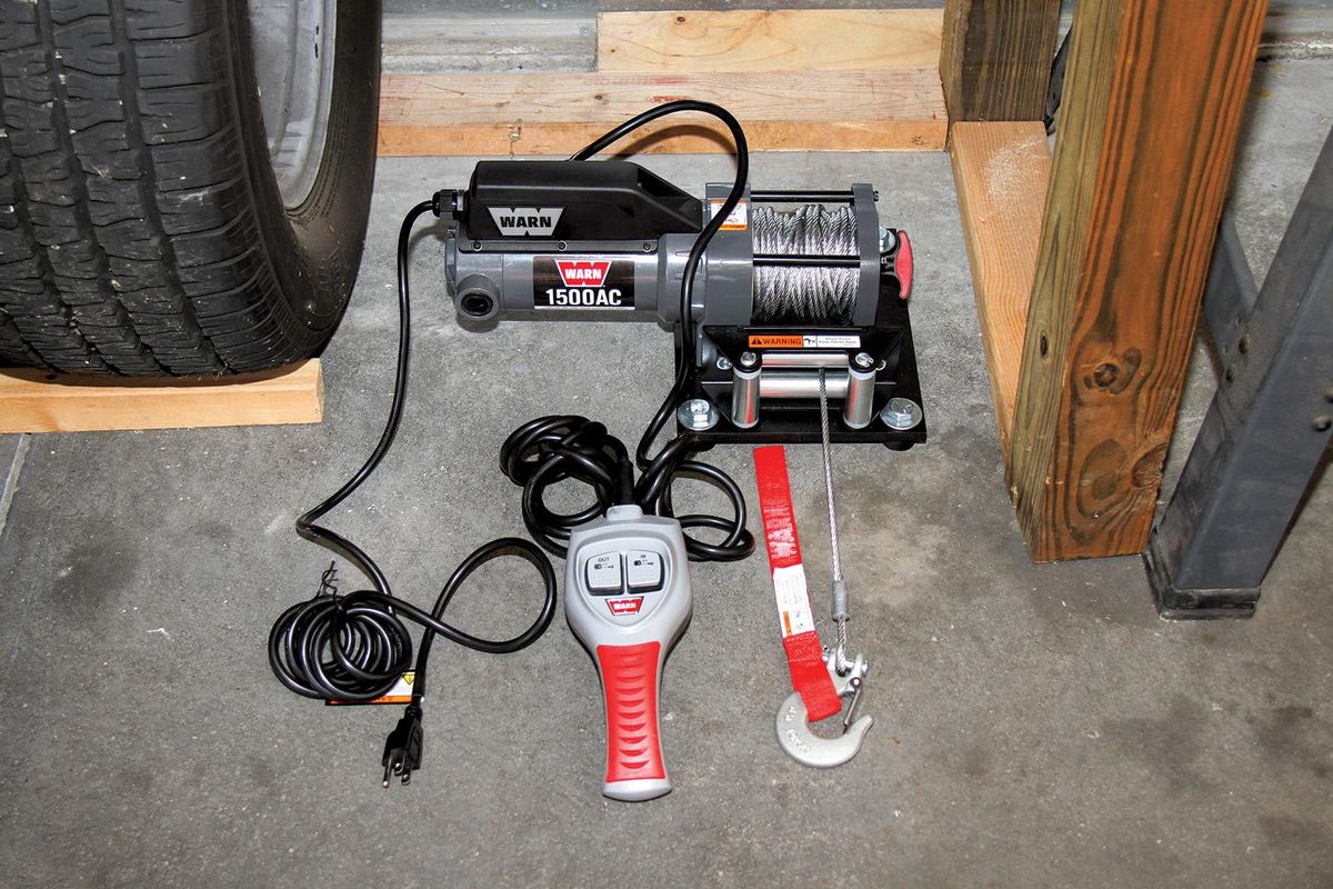 Installing an electric winch in your garage makes moving vehicles easy
