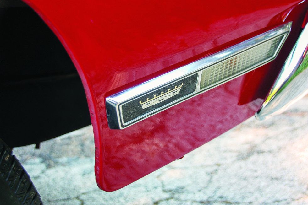 Color closeup of the side marker lamp and emblem on the fender of a 1969 Ford XL convertible.