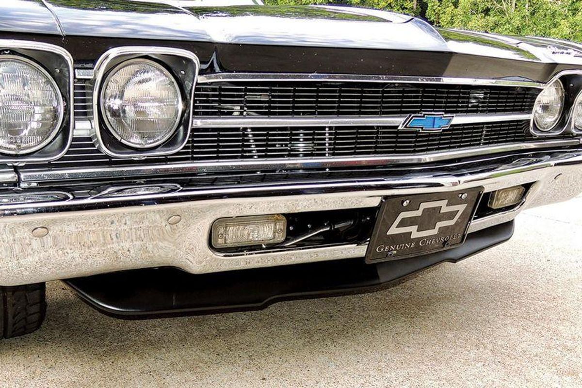 https://assets.rebelmouse.io/media-library/color-closeup-of-the-spoiler-newly-attached-underneath-the-front-clip-and-grille-of-a-chevelle.jpg?id=31965012&width=1200&height=800&quality=90&coordinates=75%2C0%2C75%2C0
