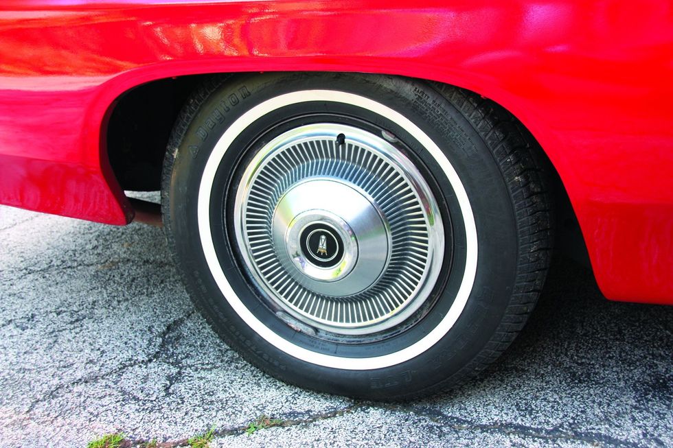 Color closeup of the wheel and tire on a 1969 Ford XL convertible.