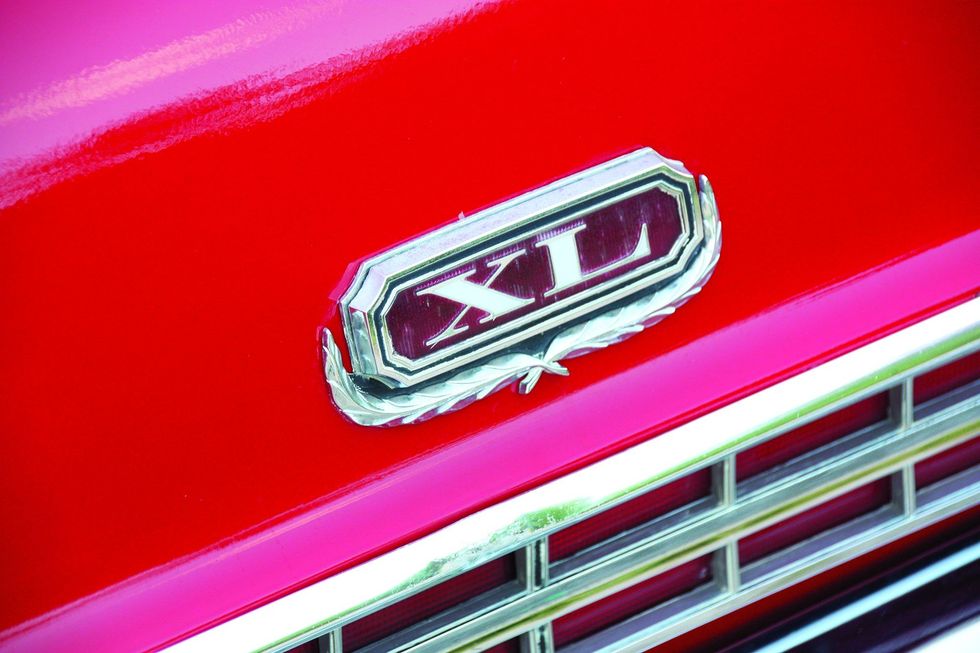 Color closeup of the "XL" emblem on the trunk of a 1969 Ford XL convertible.
