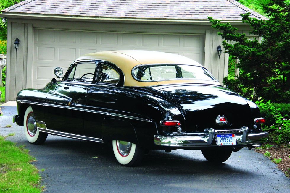 Color image of a 1950 Mercury Monterey Sport Coupe parked in a rear 3/4 position.