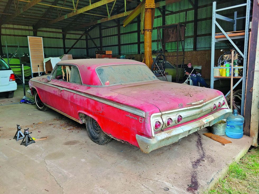 Color image of a 1962 Chevrolet Impala barn find, rear 3/4 position.