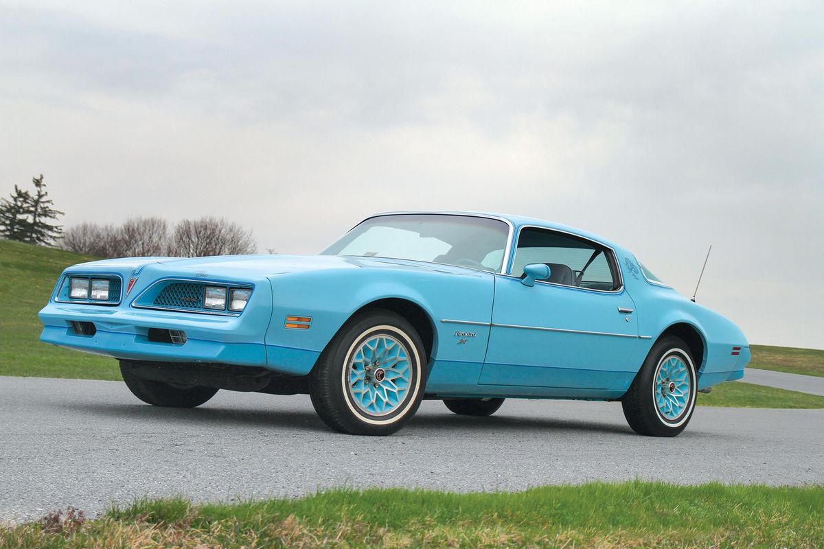Color image of a 1978 Pontiac Firebird, sky bird edition, front 3/4 position, sky in background.