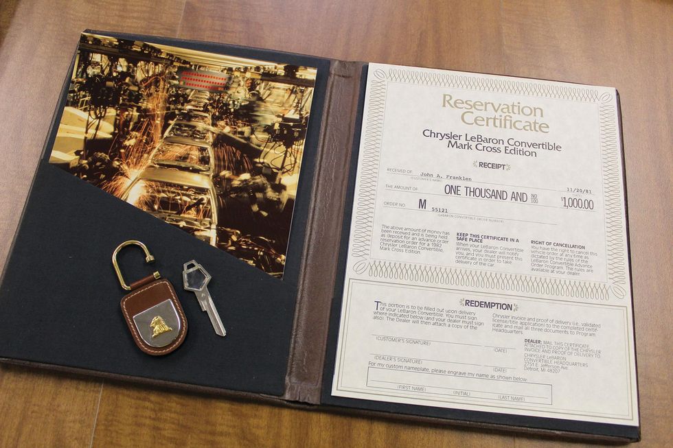Color image of documents in the leatherette portfolio that came with the Chrysler LeBaron Medallion Mark Cross edition.