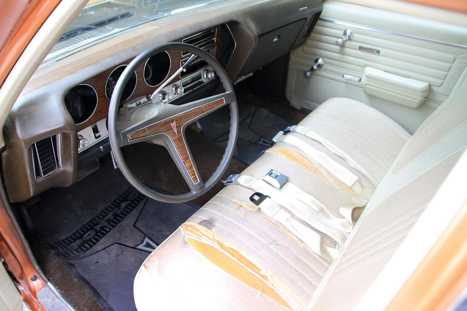 Color image of the dash, interior, seats and door panel in a 1972 Pontiac Le Mans.