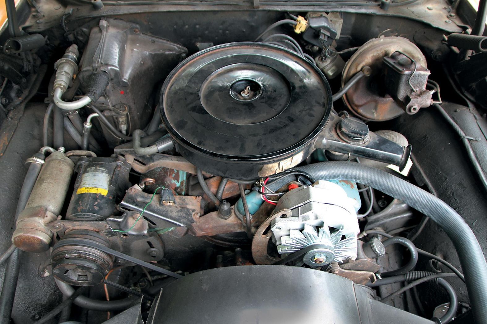 Color image of the engine bay in a 1972 Pontiac Le Mans, 350 V-8 engine.