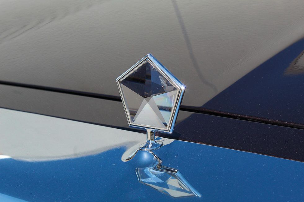 Color image of the hood ornament on a Chrysler LeBaron Mark Cross Edition