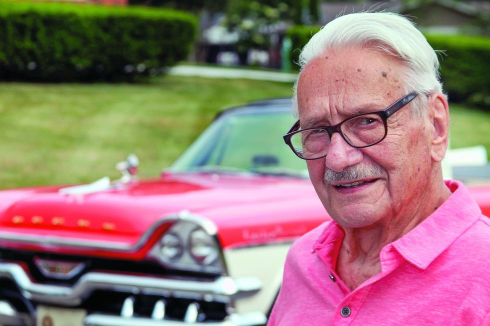 Color image of the owner with his 1957 Dodge Custom Royal D-500.