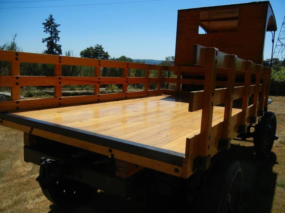 Rear view of a Nash Quad motor reel truck equipped with a wood