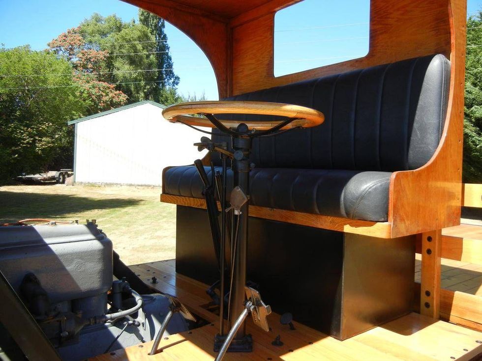 Rear view of a Nash Quad motor reel truck equipped with a wood