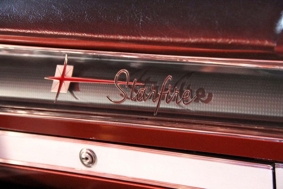 Oldsmobile Starfire dash badge