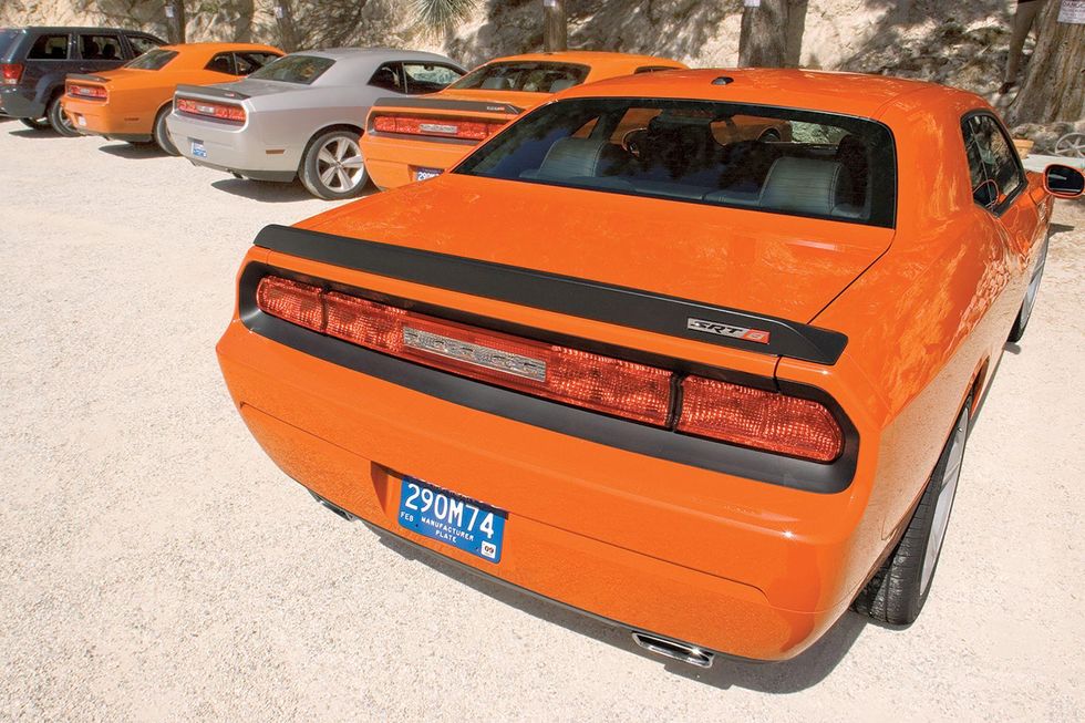 Several Dodge Challenger SRT8s lined up, rear 3/4 position.